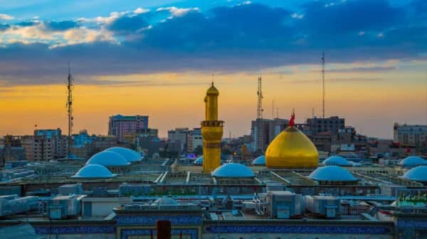 Golden domes and minarets of a mosque at sunset, representing Islamic charity and the fulfillment of sacred vows like Koonday ki Niyaz, supported by crypto donations via USDT.