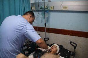 Medical professional caring for a child patient, highlighting general healthcare and children's health programs.Aid facilitated by crypto donations, including SOL.