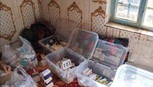 Transparent bins filled with medical supplies and boxes of medication, organized for distribution. Aid generously supported by ETH for healthcare relief.
