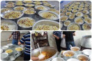 Large metal pots filled with rice and toppings, prepared for distribution to the needy, demonstrating crypto zakat donations supporting food aid to Muslim communities.