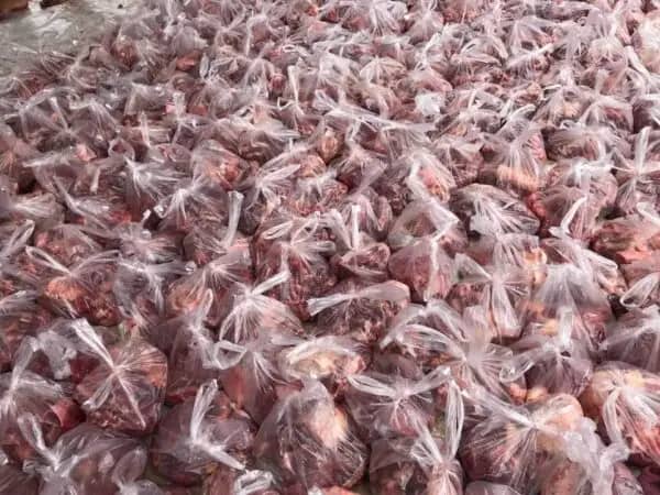 Relief Qurbani donations of meat in plastic bags, supporting global food security through crypto aided charitable giving via USDT.