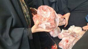 Hands holding packages of halal meat for Aqiqah Qurbani, with donation facilitated by Bitcoin, spread joy and nourishment to the needy.