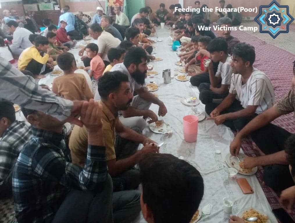 Men and boys gathered for a communal meal in a hall providing sustenance to a war victims camp, supported by crypto donations like Ethereum for feeding the Fuqara.