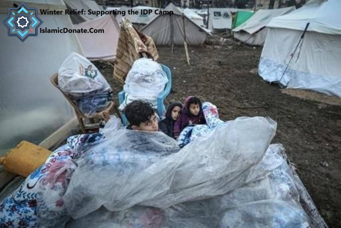 Children huddled together in a makeshift shelter at an IDP camp, receiving warm blankets and clothing for winter relief, enabled by cryptocurrency donations like BTC.