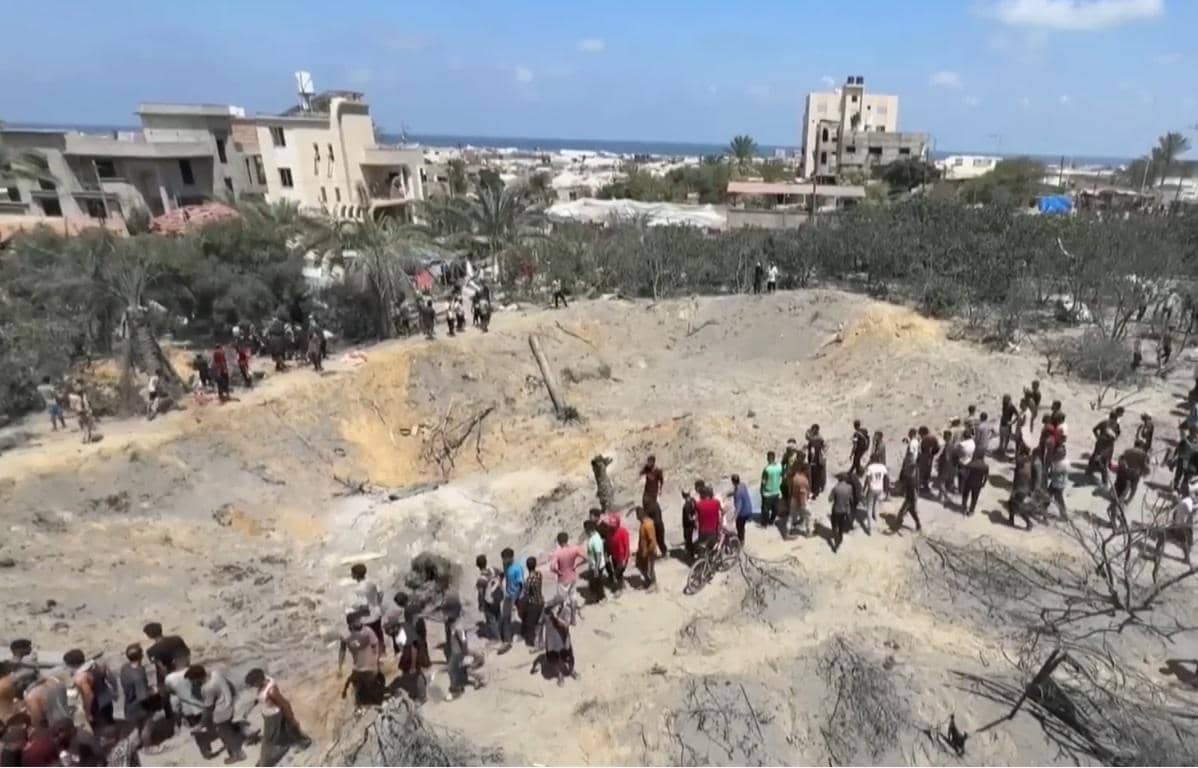 Palestine's damaged infrastructure with a crowd gathered around bomb craters, suggesting the need for aid and reconstruction, with potential for crypto donations like Bitcoin to support relief efforts.