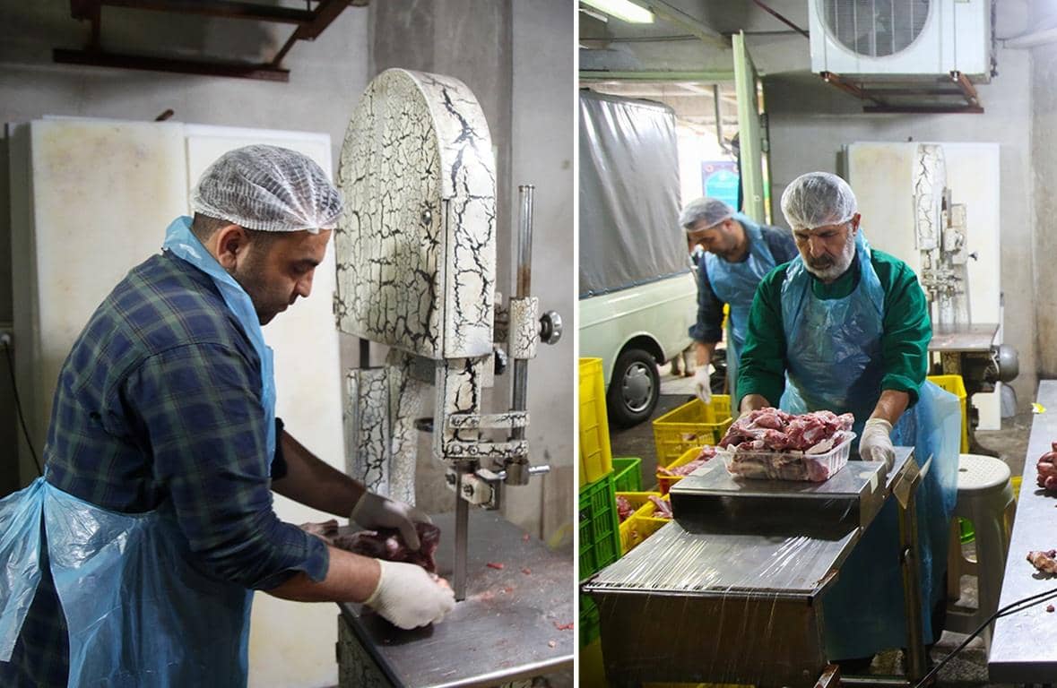 Men in hairnets and aprons processing sacrificial meat with a band saw and scales for distribution across Africa and Asia on Eid al-Adha, facilitated by crypto donations like Bitcoin and Ethereum.
