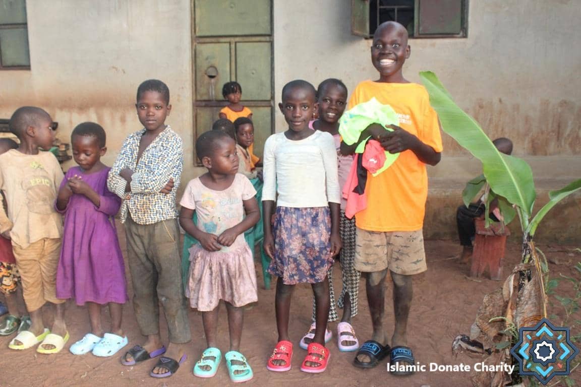 A diverse group of smiling children, some in new clothes, stand together. These children are receiving educational support through crypto donations. Their smiles show hope and futures empowered by ETH.