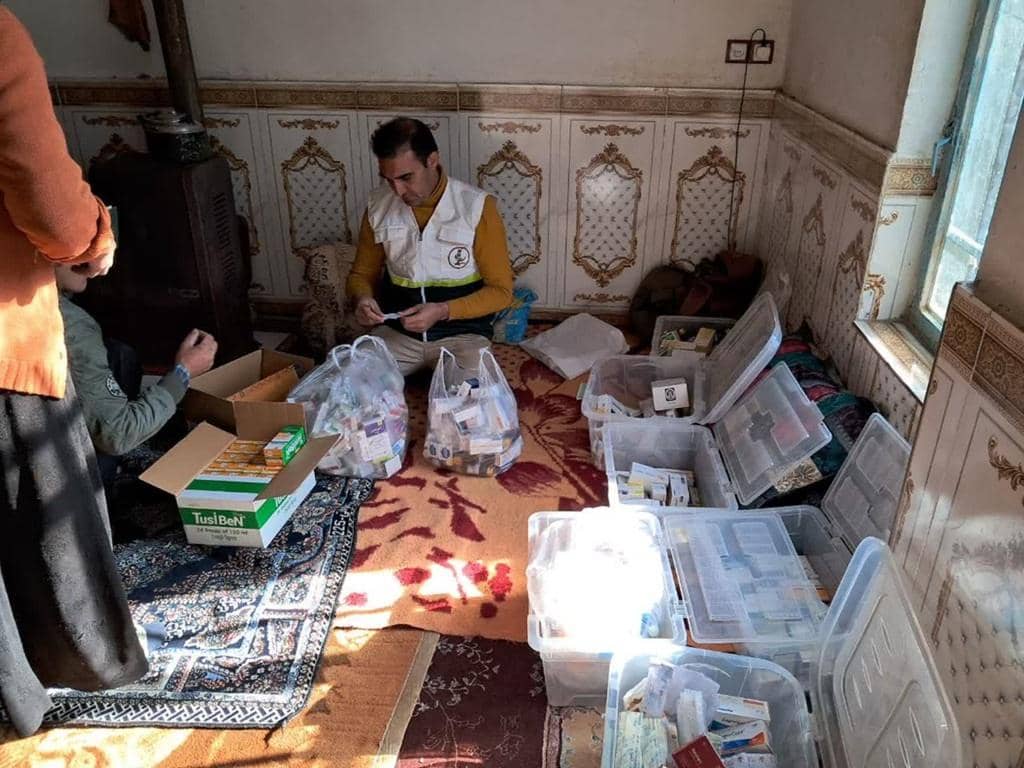 Volunteers sort medications for healthcare relief, with donations supported by Ethereum (ETH).