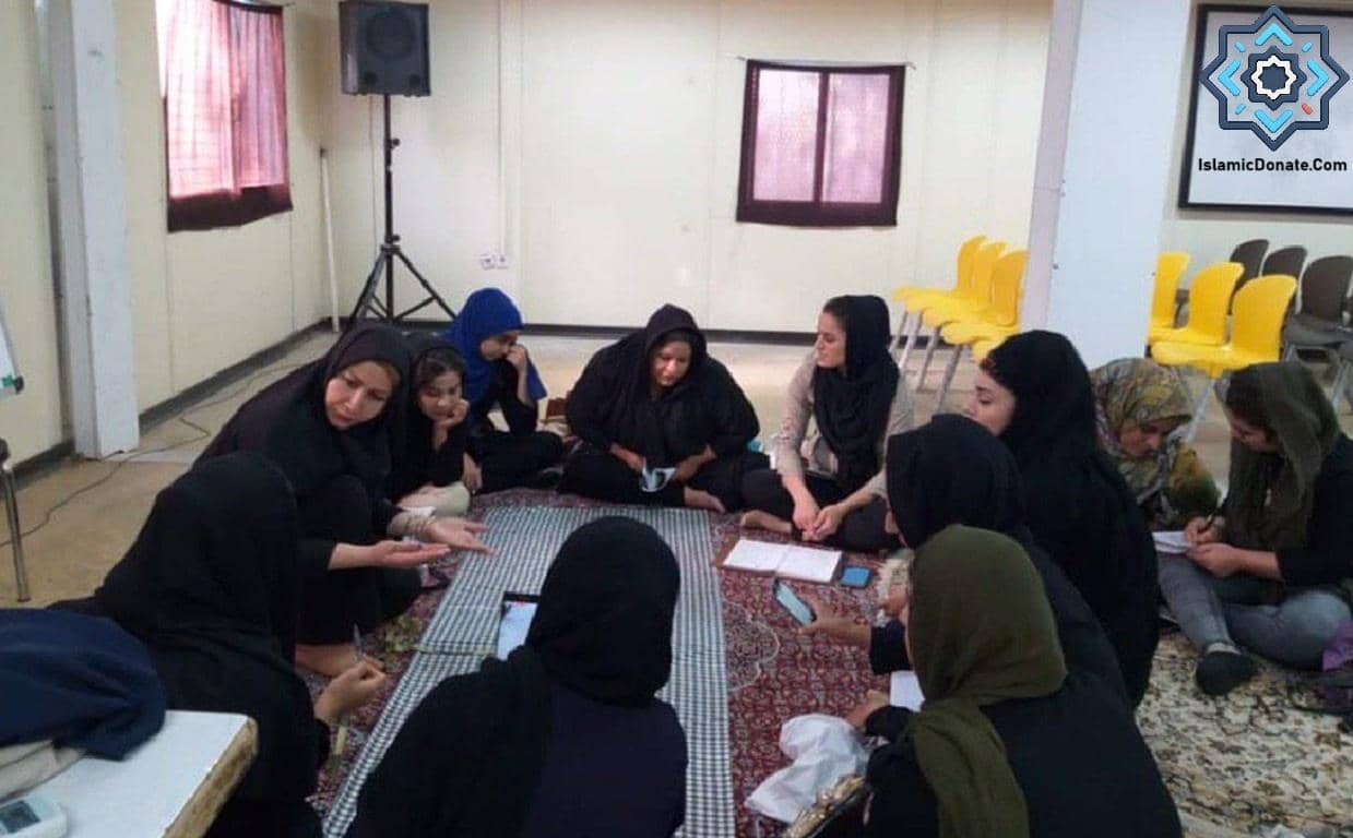 Women in a group discussion session, learning about maternal health and education, with donations in XRP supporting their healthcare programs.