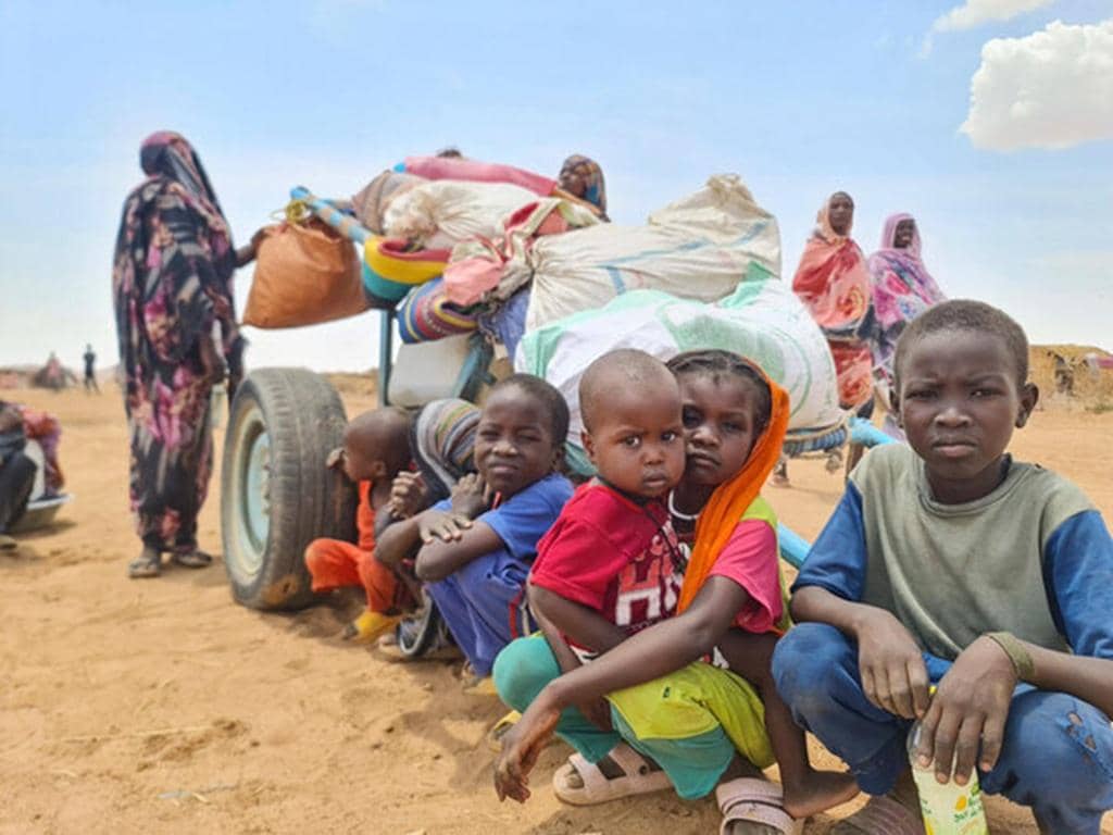 Children of Sudan and South Sudan displaced by conflict, waiting for humanitarian aid, accepting crypto donations like BTC.
