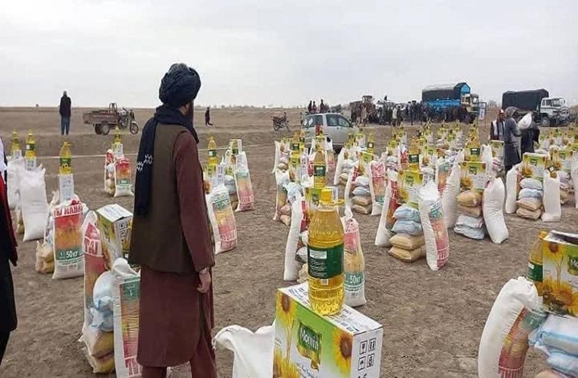 Donate crypto to Afghanistan relief efforts. Numerous bags of food and bottles of oil are arranged for distribution. Aid is supported by USDT.