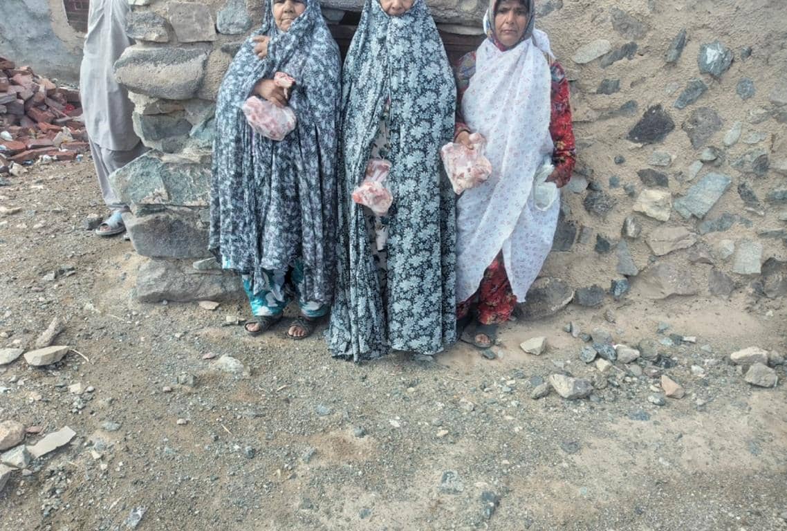 Three women receive meat donations, distribution of Qurbani through modern cryptocurrency like USDT, aiding needy Muslim communities in charitable endeavors.