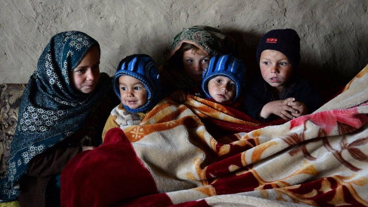 Children huddled together, showcasing the critical need for basic necessities like food, shelter, and healthcare for infants and orphans, supported by crypto donations via ETH.