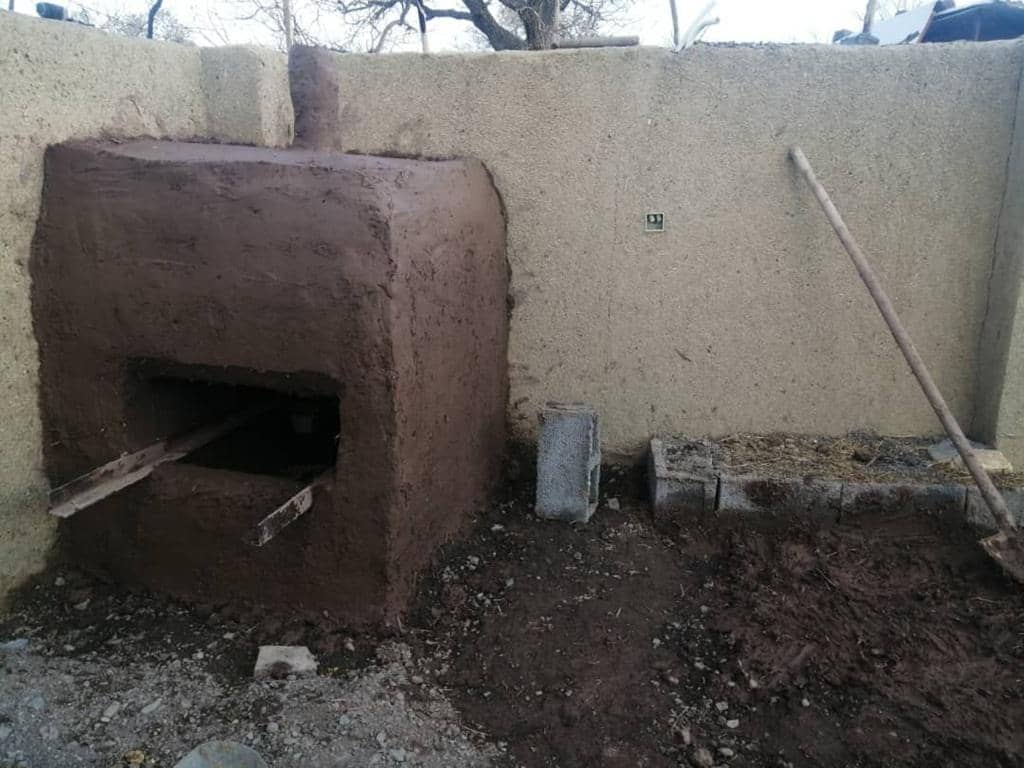 Clay oven built to support widows and single mothers, enabling them to bake bread and regain dignity, with crypto donation support via ETH.