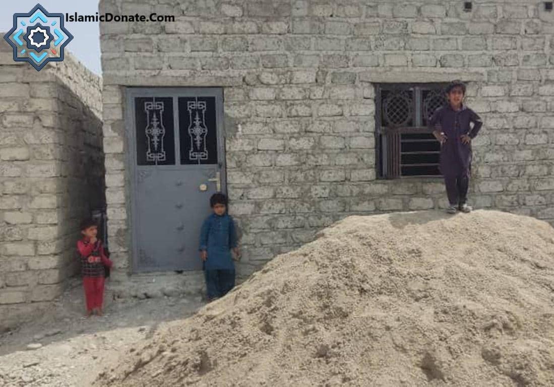 Children stand near a humble brick building, symbolizing the need for Zakat donations to support the Muslim community. Supports crypto Zakat calculations for Bitcoin, Ethereum, and other digital assets.