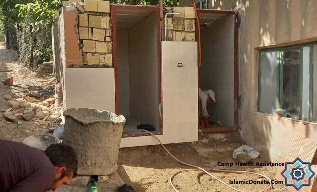 Construction of sanitation facilities in a Palestinian camp. Essential aid, including camp health assistance and cryptocurrency donations for Palestine. Donate with PayPal USD.