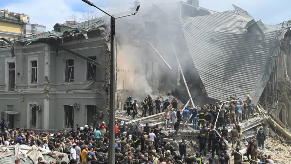 Kyiv children's hospital attack aftermath with rescue workers amid rubble. Crypto donations of medical supplies and food for Ukraine are urgently needed, potentially via ETH.