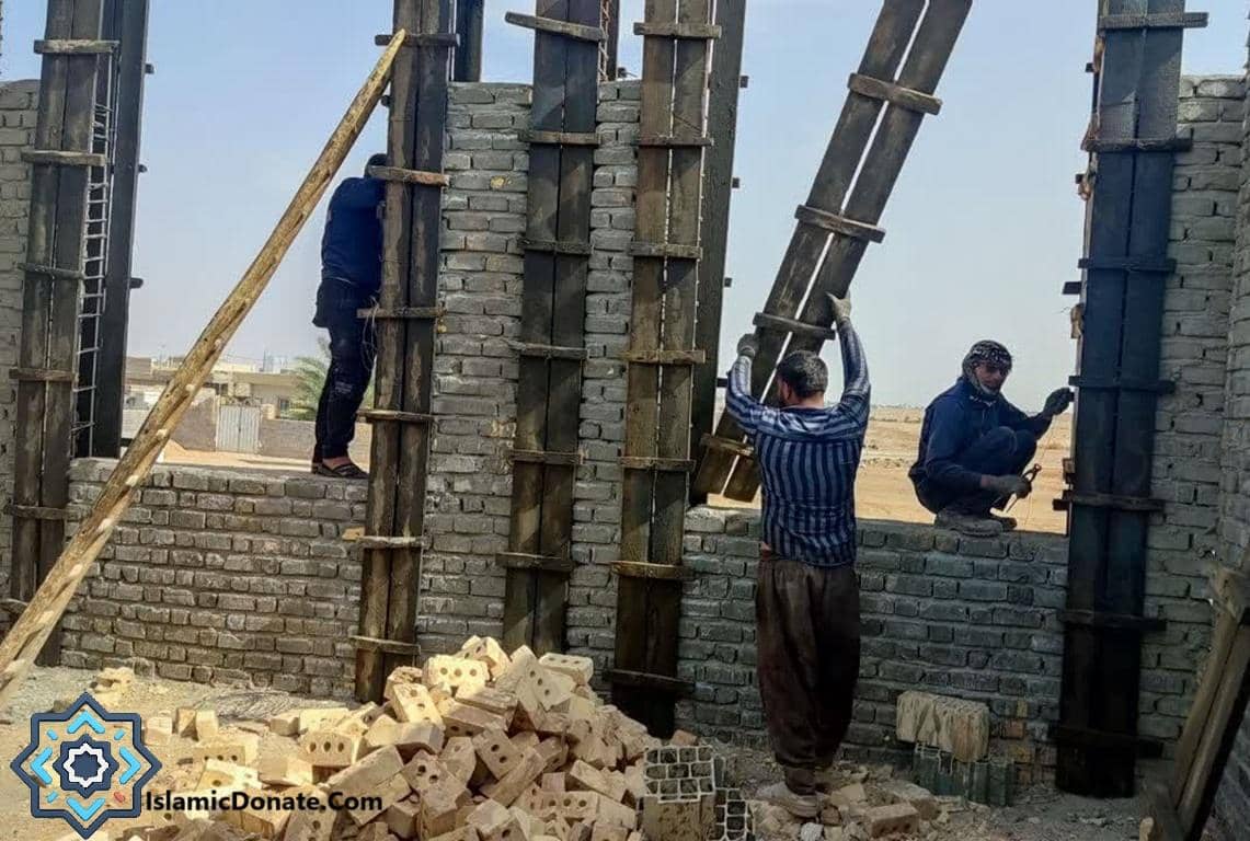 Construction workers building a mosque, a type of Sadaqah Jariyah project enabled by cryptocurrency donations like USDT.