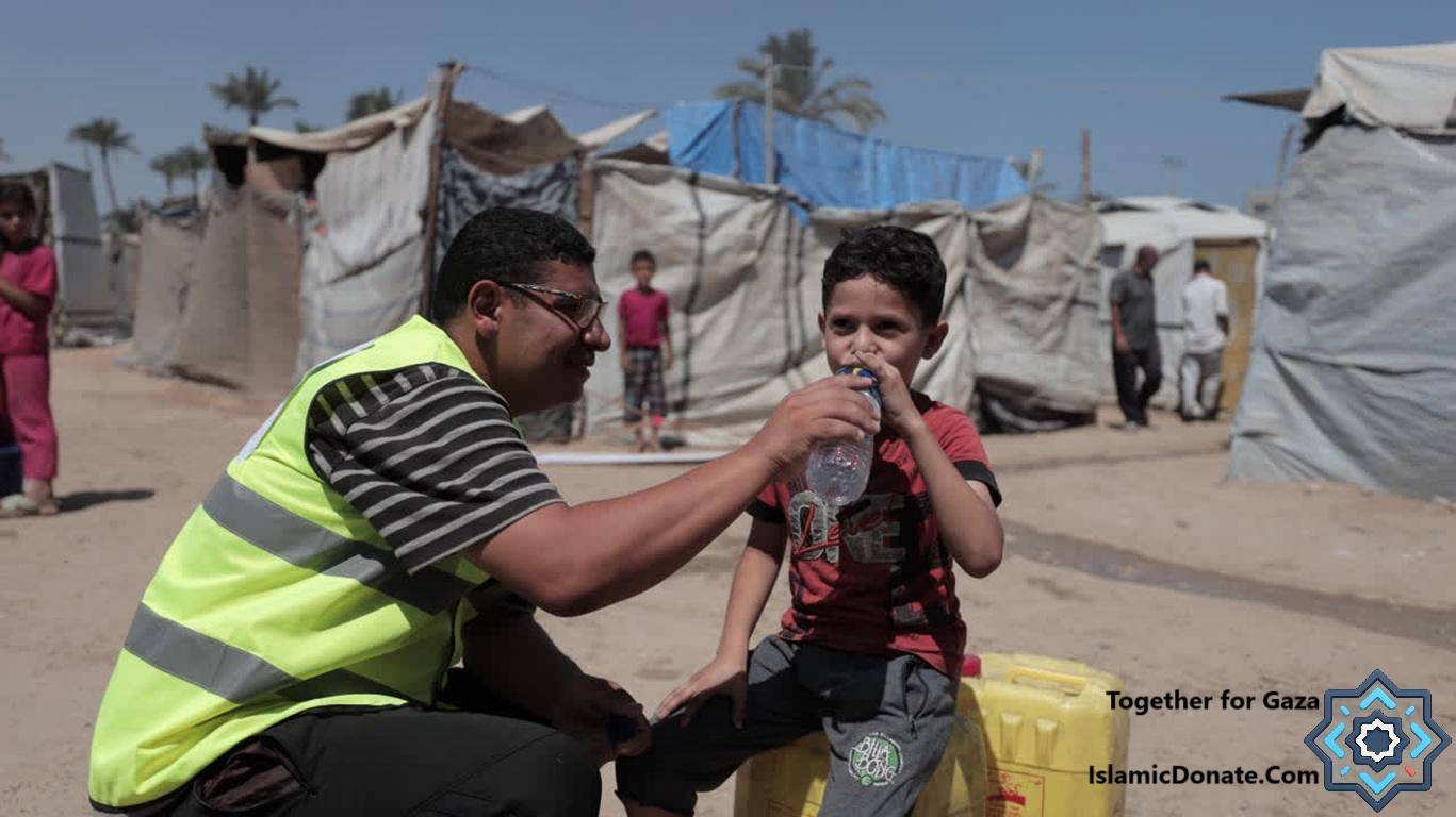 Aid worker gives water to a child in a Gaza camp, symbolizing hope and relief delivered through crypto donations thanks to the latest BTC blockchain. Humanitarian aid, life-saving supplies, and clean water are critical.