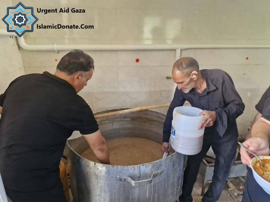 Two men preparing food in a large pot for urgent aid to Gaza, with donations supported by LTC.