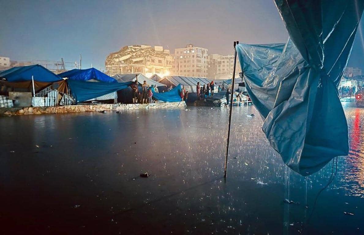 Gaza refugees in flooded makeshift shelters face winter crisis, relying on crypto donations for warmth and aid.