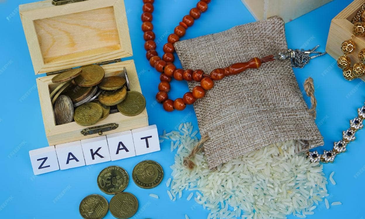 zakat al-fitra donation with coins, rice, and prayer beads for Eid al-Fitr, supporting needy with USDT