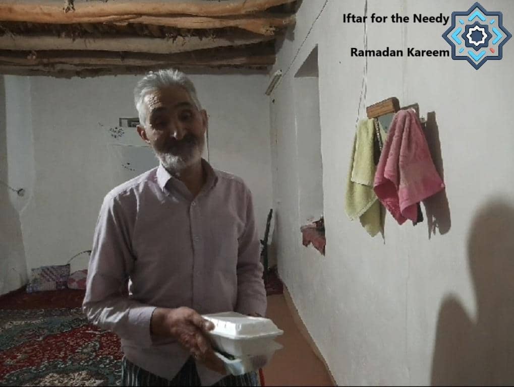 An elderly man holding a food container, symbolizing Ramadan Iftar for the needy, supported by crypto donations like Bitcoin for charitable giving.