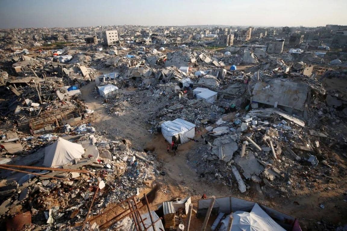 War-torn landscape with makeshift tents and rubble, depicting the devastation in Gaza and the urgent need for humanitarian aid. Your crypto zakat donations, processed via XRP, provide essential relief with direct impact.