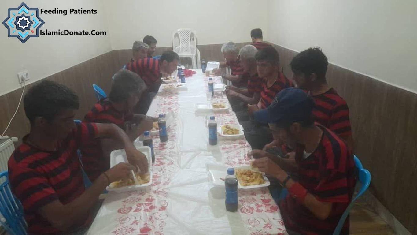 Young men in red and black striped shirts eating meals at a long table, with bottles of drink provided, a donation that purifies the soul, supported by ETH.