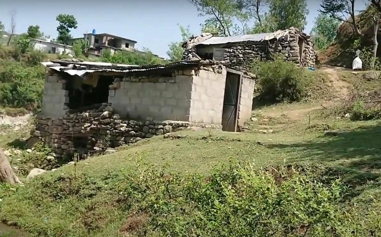 Dilapidated stone and concrete structure in a rural setting, representing the need for aid. Crypto donations via USDT help provide hot meals and shelter for struggling families, supporting orphaned children and widows in building sustainable livelihoods.