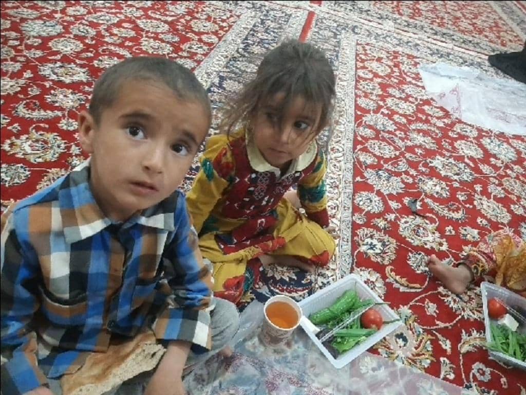 Children receiving food aid in crisis zones, supported by BTC donations for the hungry, orphans, and refugees in regions like Palestine and Yemen.