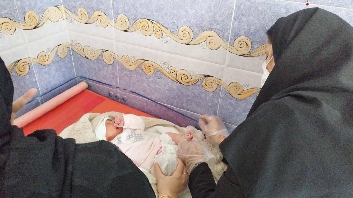 Healthcare workers tending to a newborn, symbolizing crypto for good in maternal health and infant care, supported by ETH donations.