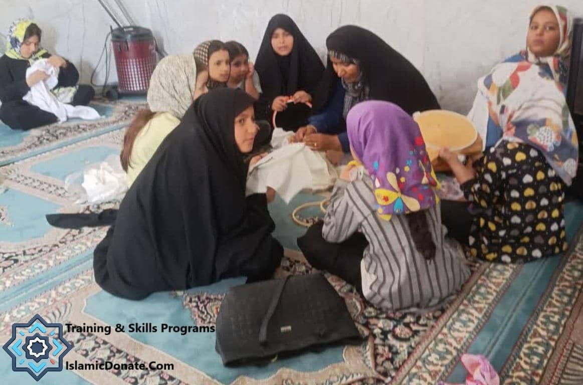 Group of women and girls learning embroidery, receiving vocational training funded by cryptocurrency donations.
