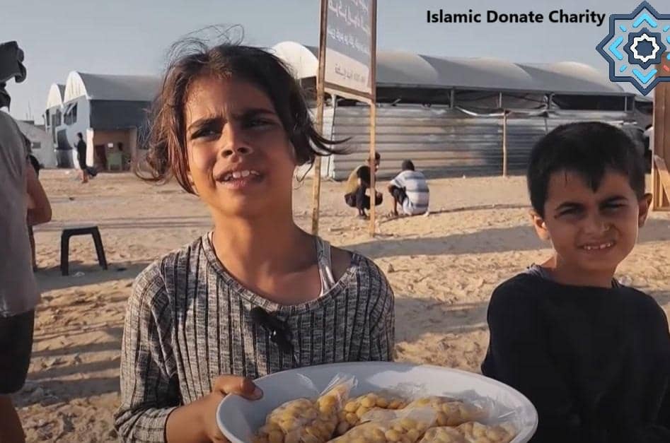 Two children receiving food aid, with HODL Hope crypto donations providing sustenance and hope through Islamic Donate Charity, supported by SOL.