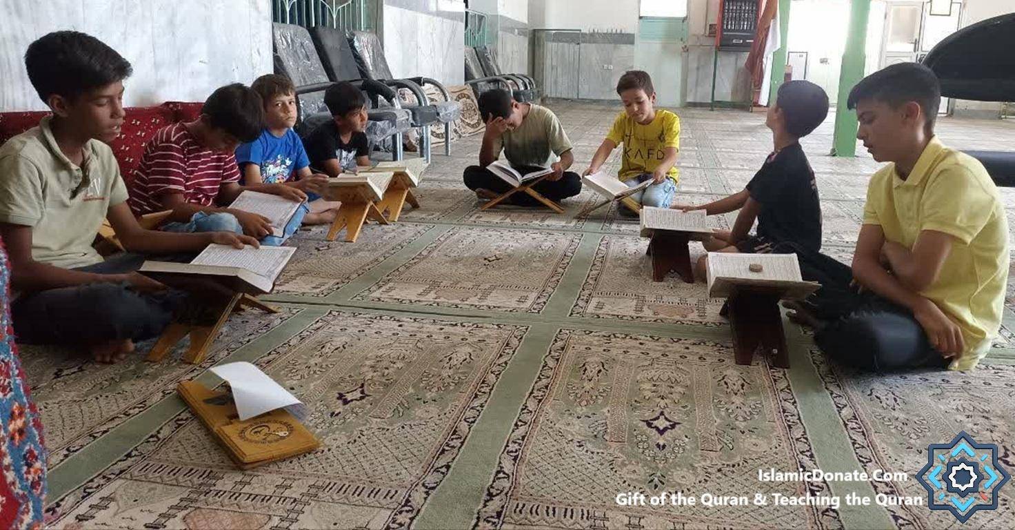 Boys learn and recite the Quran in Arabic with translations, supported by cryptocurrency donations via XRP facilitating guidance.