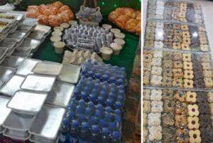 Zakat al-Fitr donation setup with packaged food and drinks, alongside trays of assorted Eid cookies, supporting the needy with crypto donations via SOL.