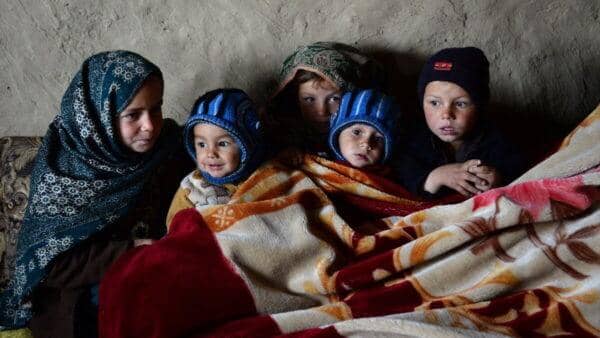 Children huddled together, showcasing the critical need for basic necessities like food, shelter, and healthcare for infants and orphans, supported by crypto donations via ETH.