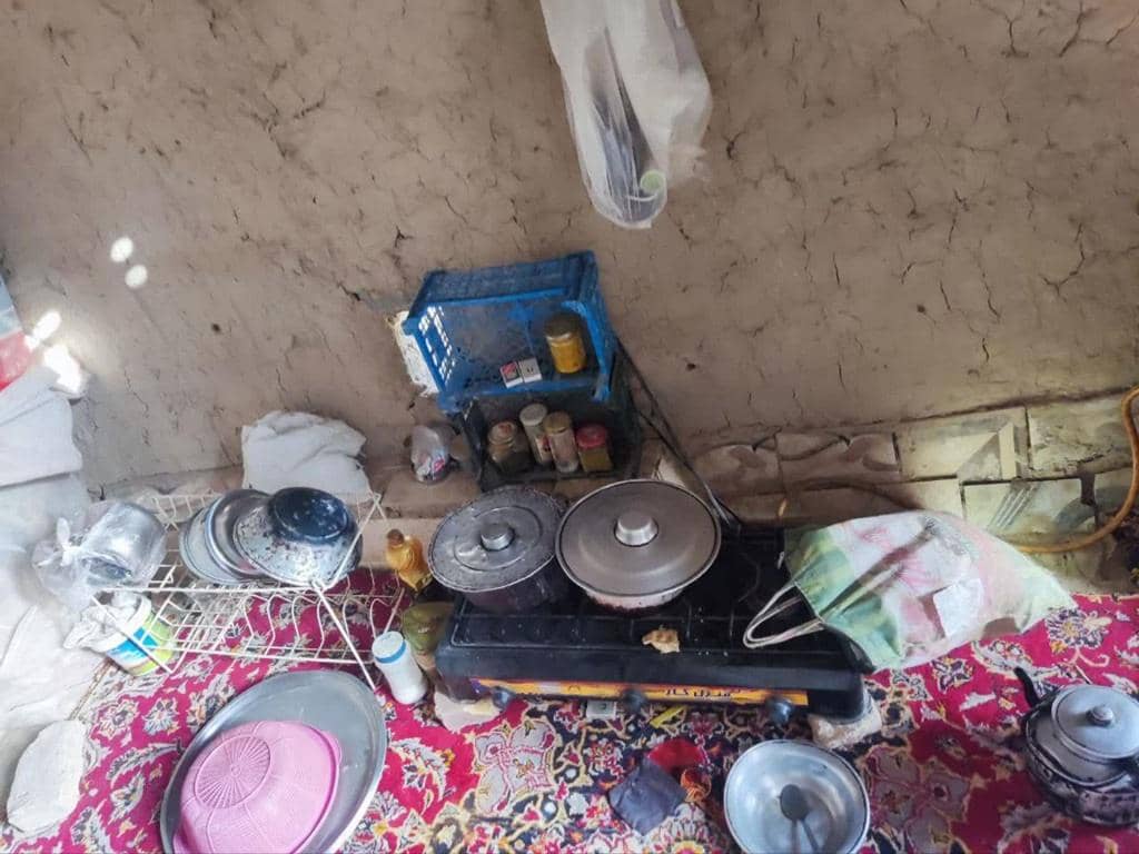 Kitchenette with propane stove, pots, pans, and spices, representing the basic needs of women in crisis, supported by crypto donations via Litecoin.