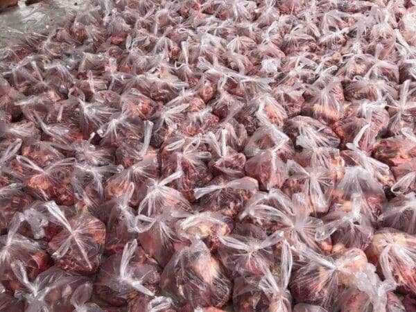 Relief Qurbani donations of meat in plastic bags, supporting global food security through crypto aided charitable giving via USDT.