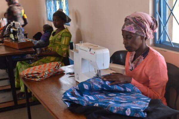 Women learning to sew hijab in an Islamic charity sewing class, supported by ETH donations.