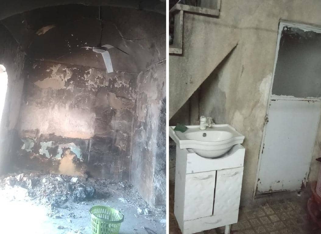 Reconstruction of a damaged room after a disaster, showing a sink and door in the background, with elements like Arab Emirates Dirham crypto donations that help rebuild homes for the needy.