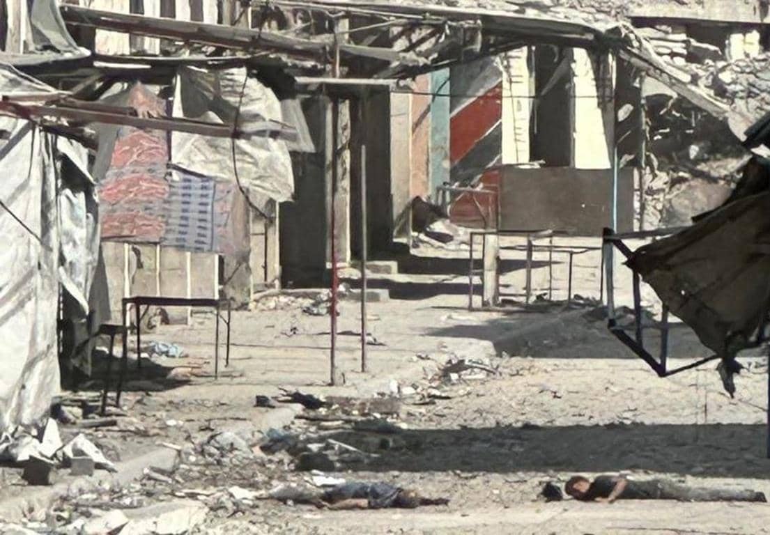 Donation for Palestine showing damaged shelters and two individuals lying on the ground. Donate crypto for food, clothing, and shelter. TRX accepted.