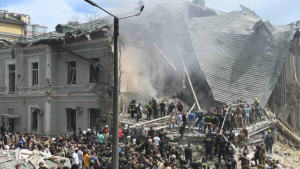 Kyiv children's hospital attack aftermath with rescue workers amid rubble. Crypto donations of medical supplies and food for Ukraine are urgently needed, potentially via ETH.