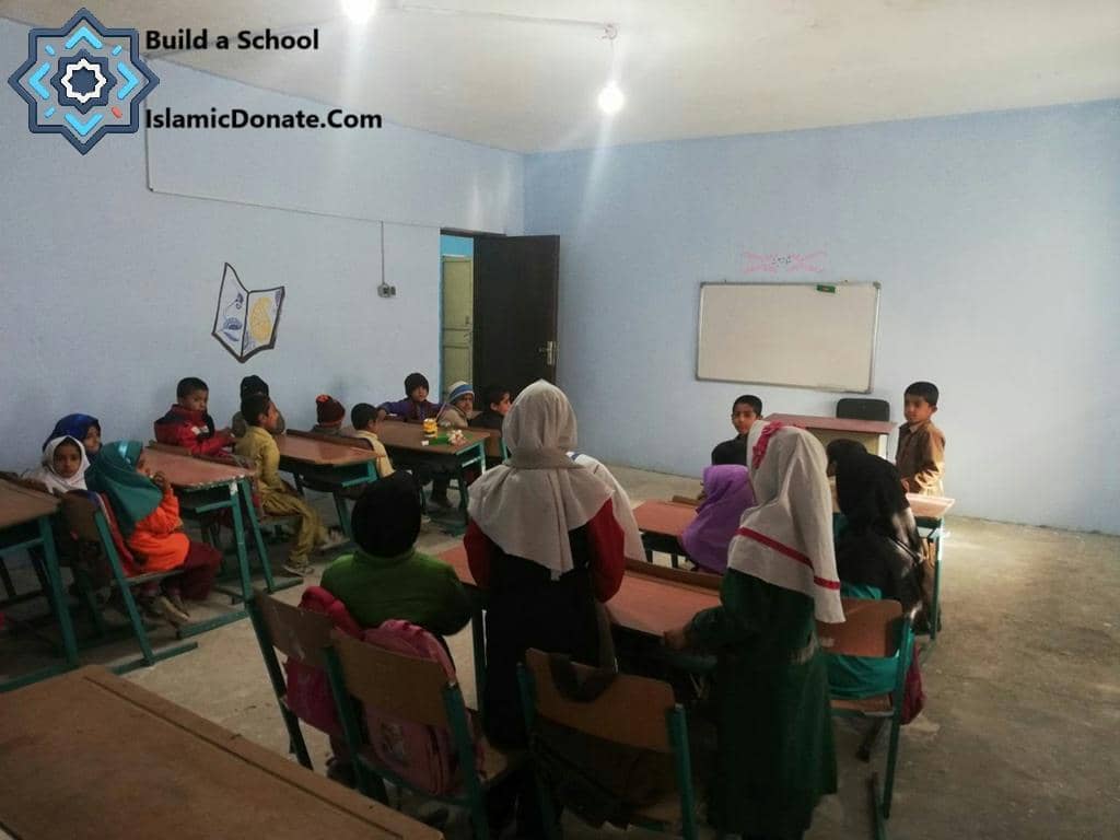 Children in a classroom setting, receiving education made possible by Sadaqah Jariyah via cryptocurrency donations such as XLM. The image depicts a learning environment funded by ongoing charity.