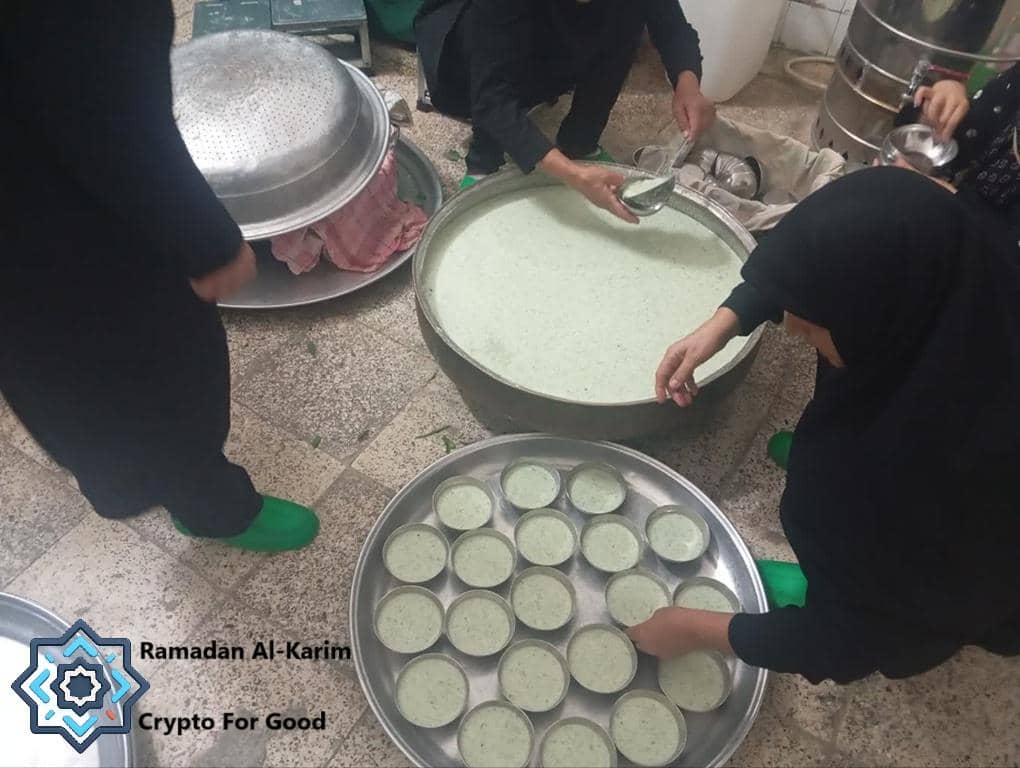 Ramadan Iftar preparation with crypto donations: Muslims ladle a light soup into small bowls, ready for distribution to those in need. Supported by Ethereum.