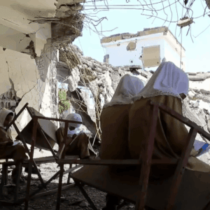 Children studying amidst destroyed classrooms, a testament to resilience empowered by crypto donations like BTC, reflecting the 49 orphans sponsored in the 2023-2024 academic year.