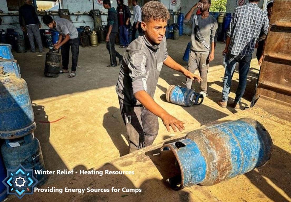 Boys handling gas cylinders for winter relief, a vital energy source for camps, enabled by AED donations.