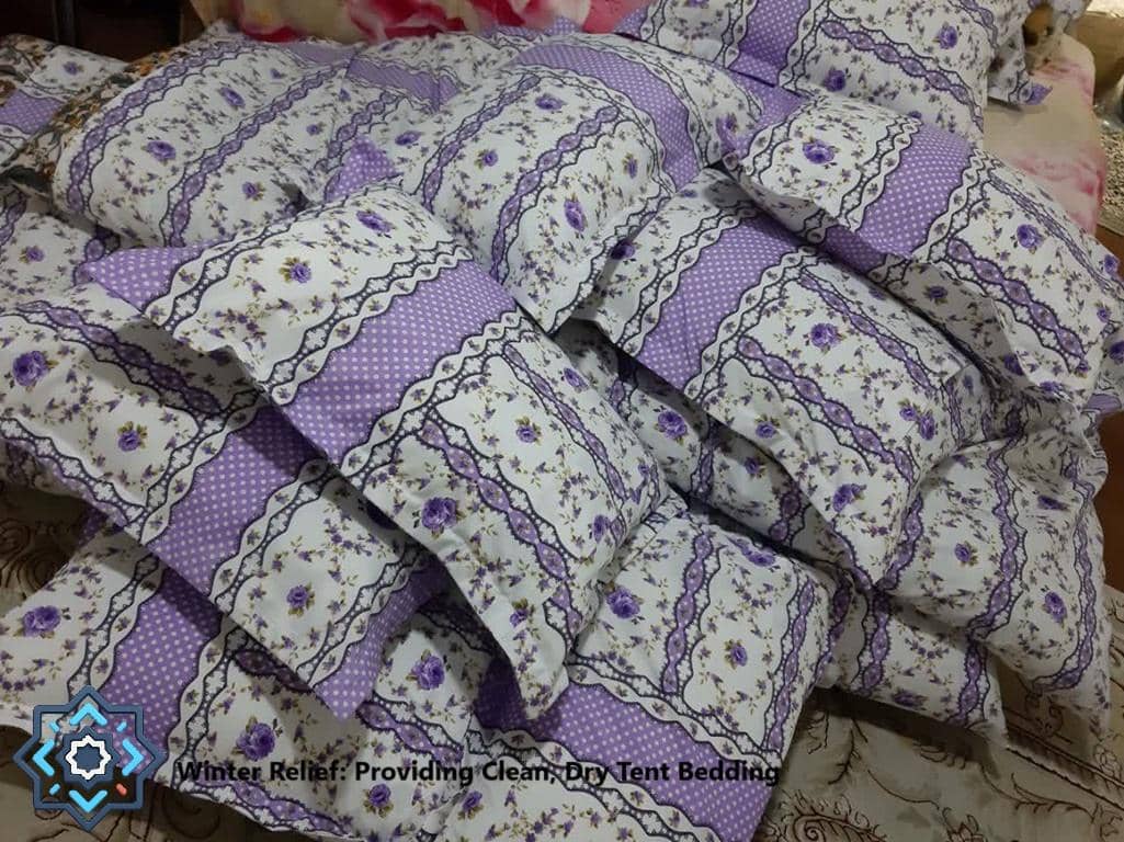 Winter relief aid of clean, dry tent bedding. Crypto donations like BTC provide warm blankets and bedding for displaced families in need.