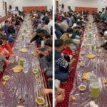 Men and children seated on the floor for iftar, enjoying a communal meal during Ramadan, with food and drinks laid out on plastic sheeting. Their donations, potentially via BTC, support such relief efforts.