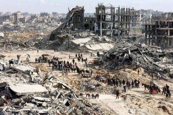 Devastation in Gaza with people sifting through rubble. Urgent aid for Palestine, including essential supplies and crypto donations via USDT.